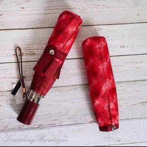 NWT Radiant Retractable Red Coach Umbrella